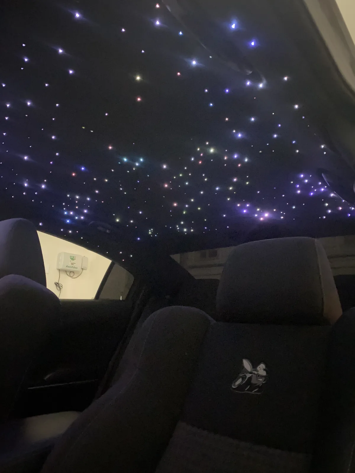 Dodge Charger Scat Pack rear cabin with a dense white and blue starlight headliner