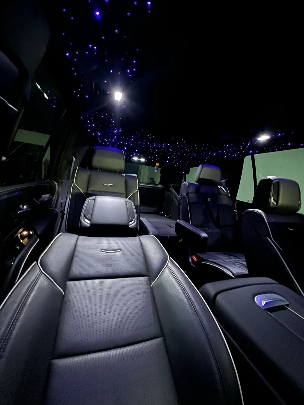 Cadillac Escalade interior with starlights around its panoramic roof