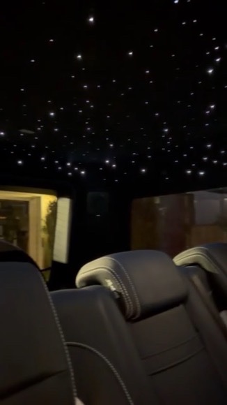 Mercedes G-Class rear-seat view with white starlights across the dark headliner