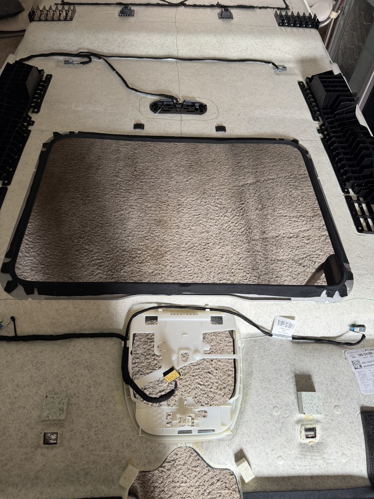 Removed Mercedes G-Class headliner with sunroof opening, overhead-console opening and factory wiring visible