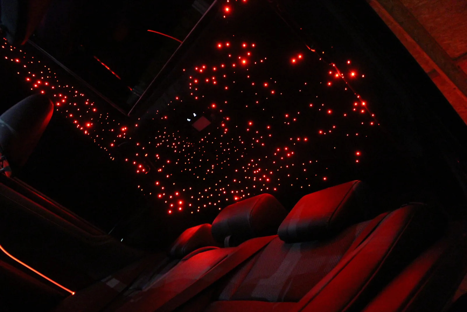 Lexus LS 500 red interior under a red-toned starlight headliner