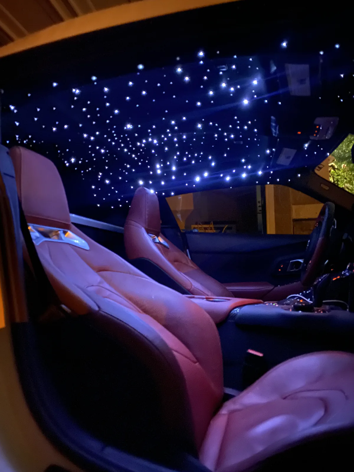 Toyota Supra red leather seats beneath a dense white starlight headliner