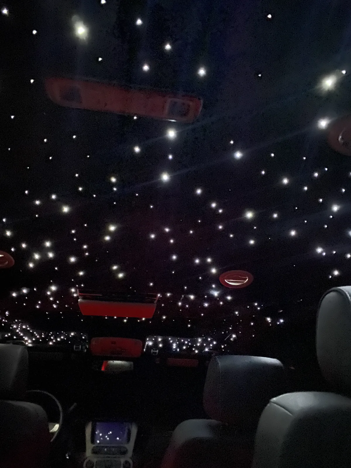 GMC Yukon headliner covered in bright white starlights above the rear seats